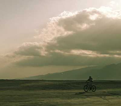 yellowish - two men biking 