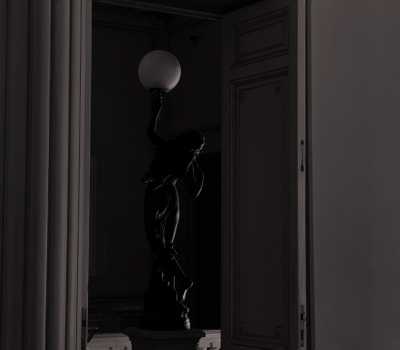 shadow - a statue behind the door